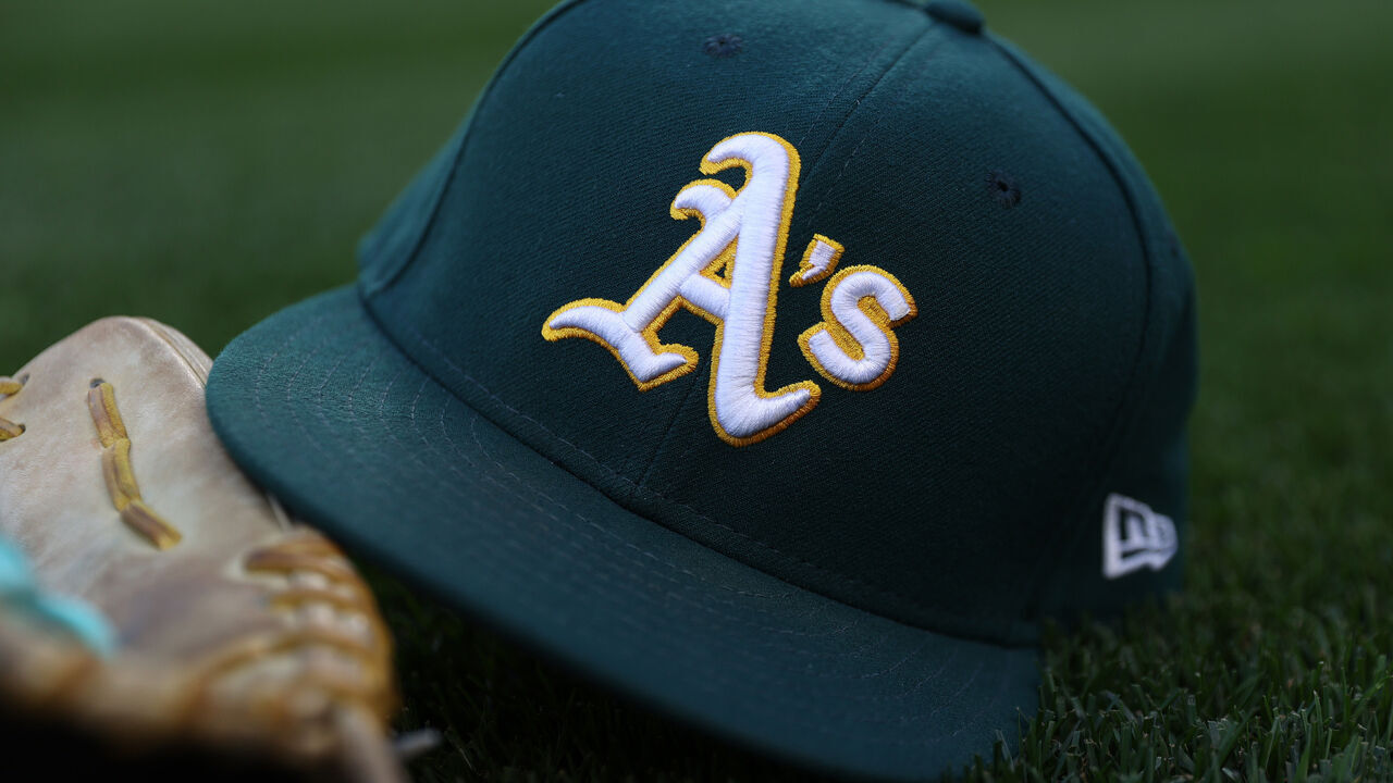 SEATTLE, WASHINGTON - SEPTEMBER 27: A general view of an Oakland Athletics logo and hat before the game against the Seattle Mariners at T-Mobile Park on September 27, 2024 in Seattle, Washington.