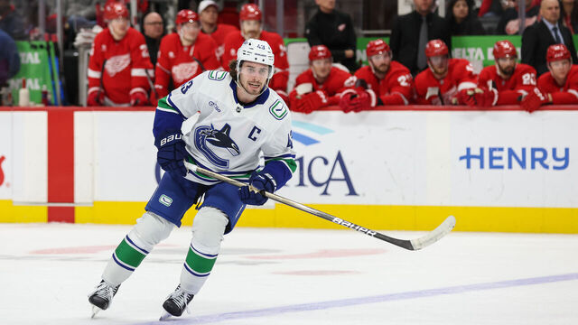 DETROIT, MI - DECEMBER 01: Vancouver Canucks defenseman Quinn Hughes (43) skates during the first period of an NHL regular season hockey game between the Vancouver Canucks and the Detroit Red Wings on December 1, 2024 at Little Caesars Arena in Detroit, Michigan.