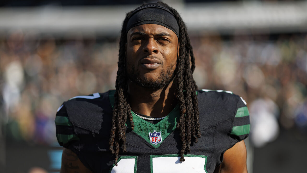 EAST RUTHERFORD, NEW JERSEY - DECEMBER 1: Wide receiver Davante Adams #17 of the New York Jets stands on the sidelines during the national anthem prior to an NFL football game against the Seattle Seahawks, at MetLife Stadium on December 1, 2024 in East Rutherford, New Jersey.