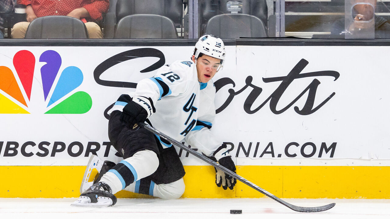 SAN JOSE, CA - OCTOBER 01: Utah Hockey Club center Tij Iginla (12) looks at the puck while getting up from the ice during a preseason NHL game between the Utah Hockey Club and the San Jose Sharks on October 1, 2024 at SAP Center at San Jose in San Jose, CA.
