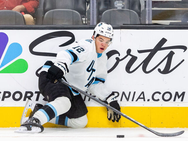 SAN JOSE, CA - OCTOBER 01: Utah Hockey Club center Tij Iginla (12) looks at the puck while getting up from the ice during a preseason NHL game between the Utah Hockey Club and the San Jose Sharks on October 1, 2024 at SAP Center at San Jose in San Jose, CA.
