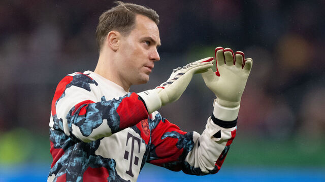 03 December 2024, Bavaria, Munich: Soccer: DFB Cup, Bayern Munich - Bayer Leverkusen, round of 16 at the Allianz Arena. A cameraman stands in the stadium before the game. Goalkeeper Manuel Neuer from Munich is warming up. Photo: Sven Hoppe/dpa - IMPORTANT NOTE: In accordance with the regulations of the DFL German Football League and the DFB German Football Association, it is prohibited to utilize or have utilized photographs taken in the stadium and/or of the match in the form of sequential images and/or video-like photo series.