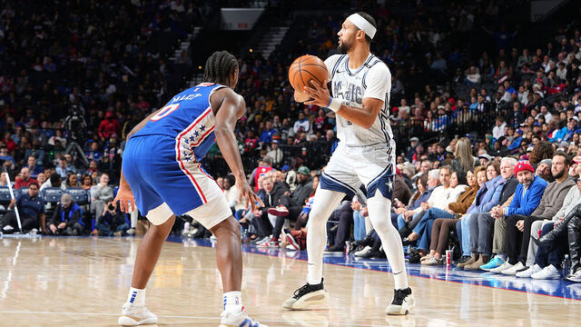 PHILADELPHIA, PA - DECEMBER 4: Jalen Suggs #4 of the Orlando Magic passes the ball during the game against the Philadelphia 76ers on December 4, 2024 at the Wells Fargo Center in Philadelphia, Pennsylvania NOTE TO USER: User expressly acknowledges and agrees that, by downloading and/or using this Photograph, user is consenting to the terms and conditions of the Getty Images License Agreement. Mandatory Copyright Notice: Copyright 2024 NBAE