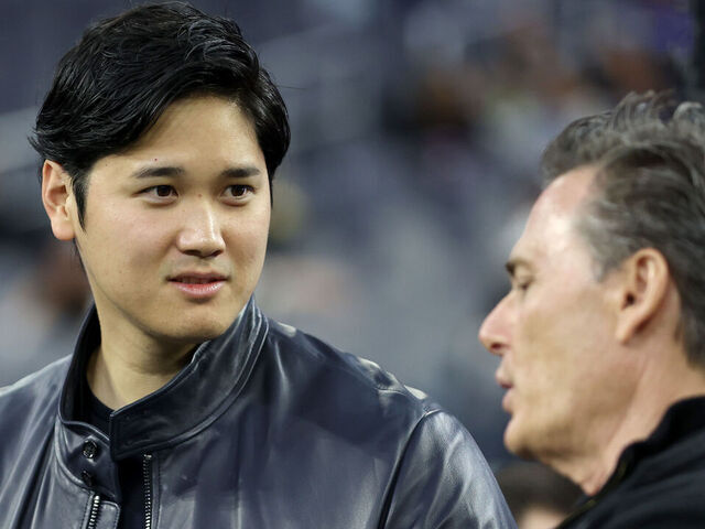 INGLEWOOD, CALIFORNIA - DECEMBER 21: (L-R) Shohei Ohtani of the Los Angeles Dodgers talks with agent Nez Balelo prior to the game between the New Orleans Saints and the Los Angeles Rams at SoFi Stadium on December 21, 2023 in Inglewood, California.