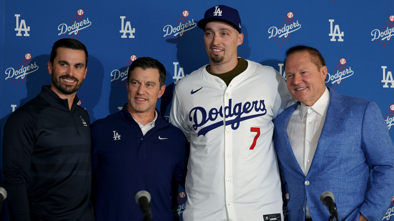 LOS ANGELES, CALIFORNIA - DECEMBER 03: Blake Snell poses for a picture with Dodgers executives Brandon Gomes and Andrew Friedman and agent Scott Boras during a press conference introducing him as a Los Angeles Dodger at Dodger Stadium on December 03, 2024 in Los Angeles, California.