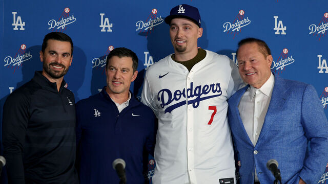 LOS ANGELES, CALIFORNIA - DECEMBER 03: Blake Snell poses for a picture with Dodgers executives Brandon Gomes and Andrew Friedman and agent Scott Boras during a press conference introducing him as a Los Angeles Dodger at Dodger Stadium on December 03, 2024 in Los Angeles, California.