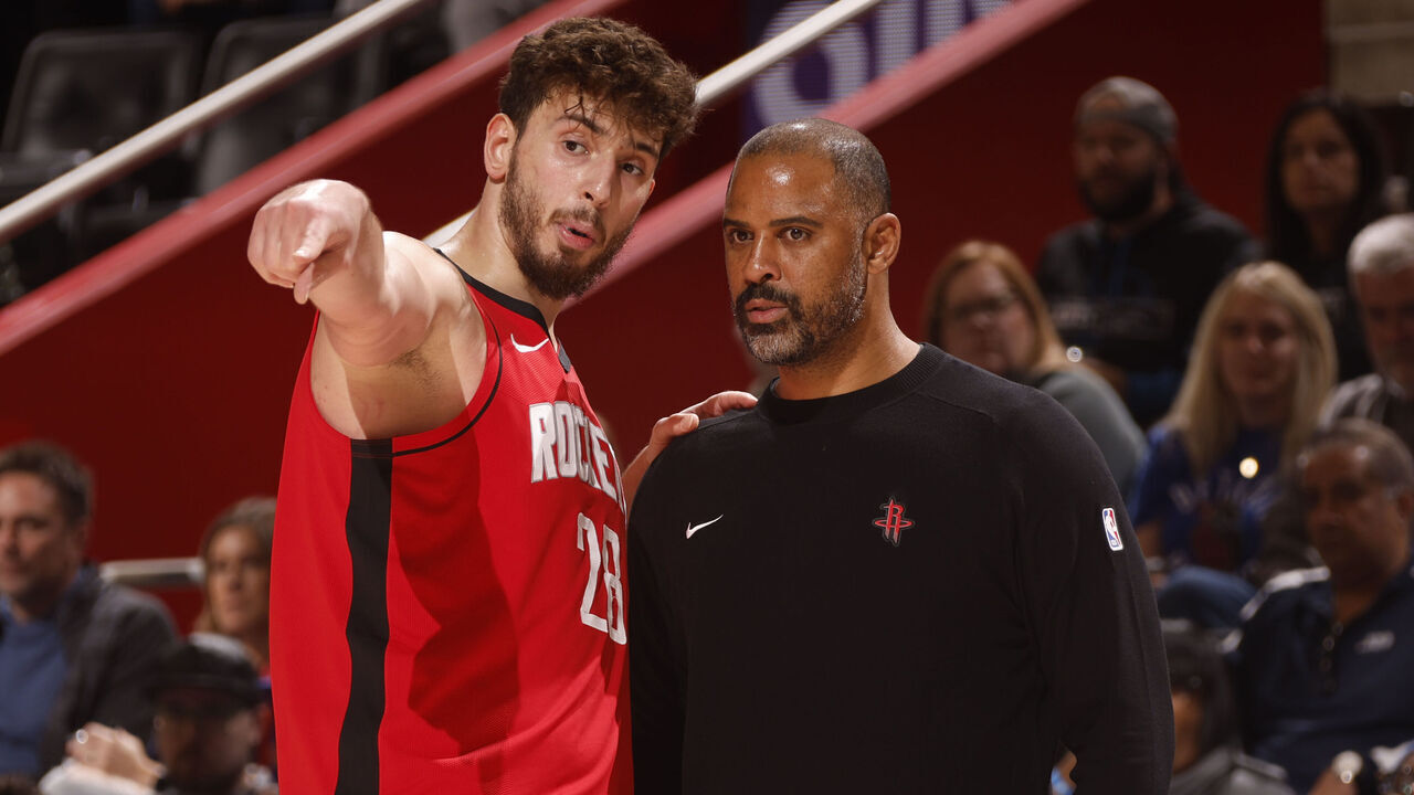 DETROIT, MI - NOVEMBER 10: Alperen Sengun #28 and Head Coach Ime Udoka of the Houston Rockets speak to each other during the game against the Detroit Pistons on November 10, 2024 at Little Caesars Arena in Detroit, Michigan. NOTE TO USER: User expressly acknowledges and agrees that, by downloading and/or using this photograph, User is consenting to the terms and conditions of the Getty Images License Agreement. Mandatory Copyright Notice: Copyright 2024 NBAE