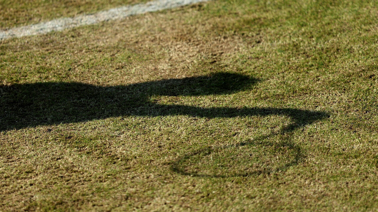 SURBITON, ENGLAND - JUNE 06: General view of the shadow of a player on the grass during the Lexus Surbiton Trophy at Surbiton Racket & Fitness Club on June 06, 2023 in Surbiton, England.
