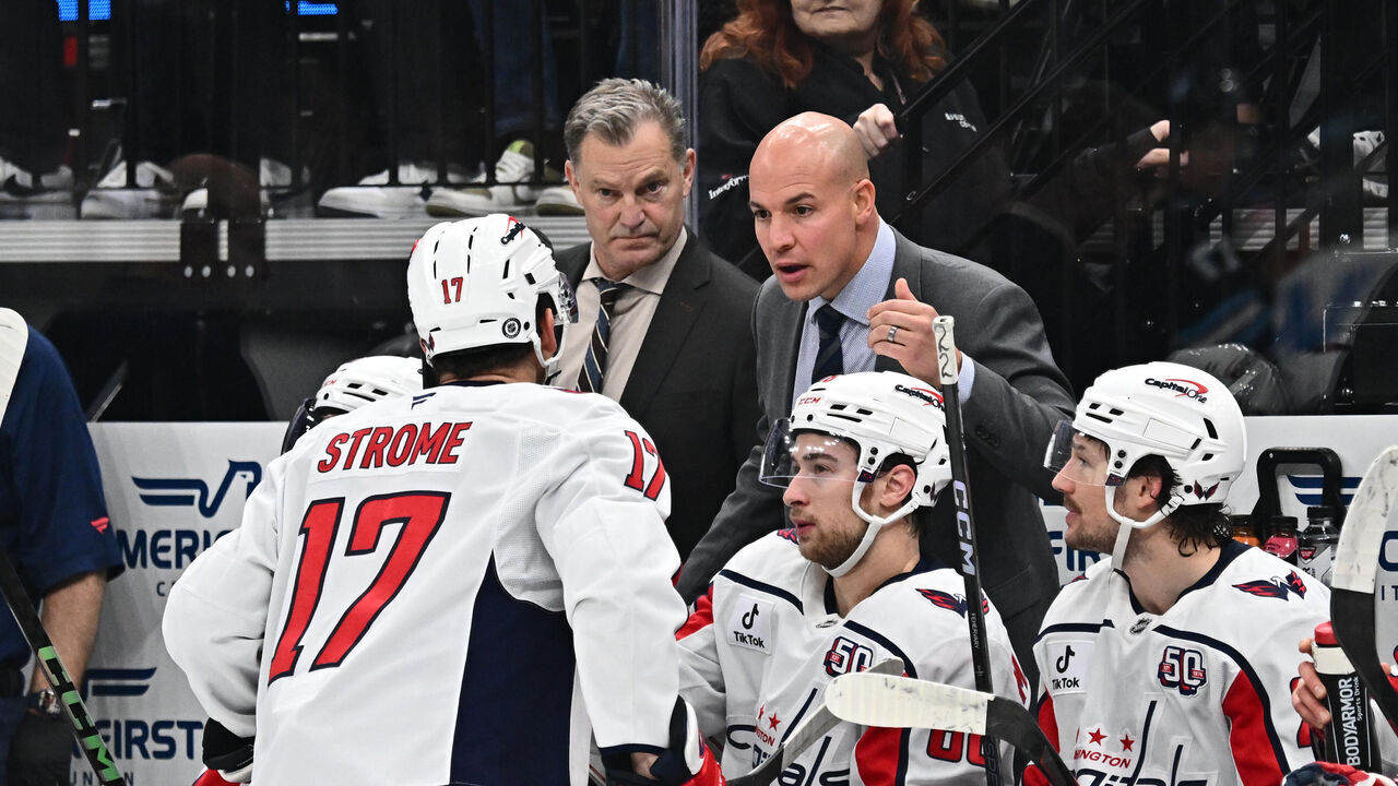 SALT LAKE CITY, UTAH - NOVEMBER 18: Head Coach Spencer Carbery of the Washington Capitals talks with Dylan Strome #17 of the Washington Capitals during the first period of a game against the Utah Hockey Club on November 18, 2024 at Delta Center in Salt Lake City, Utah.