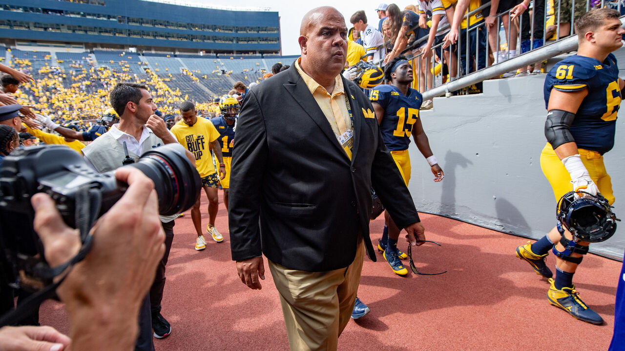 ANN ARBOR, MICHIGAN - SEPTEMBER 02: Athletic Director Warde Manuel of the Michigan Wolverines is seen leaving the field after a college football game against the East Carolina Pirates at Michigan Stadium on September 02, 2023 in Ann Arbor, Michigan. The Michigan Wolverines won the game 30-3.