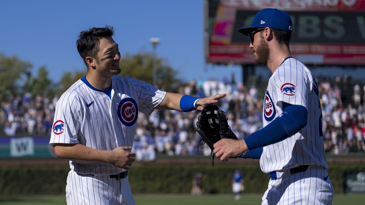 CHICAGO, ILLINOIS - SEPTEMBER 20: Seiya Suzuki #27 and Cody Bellinger #24 of the Chicago Cubs celebrate a win in a game against the Washington Nationals at Wrigley Field on September 20, 2024 in Chicago, Illinois.