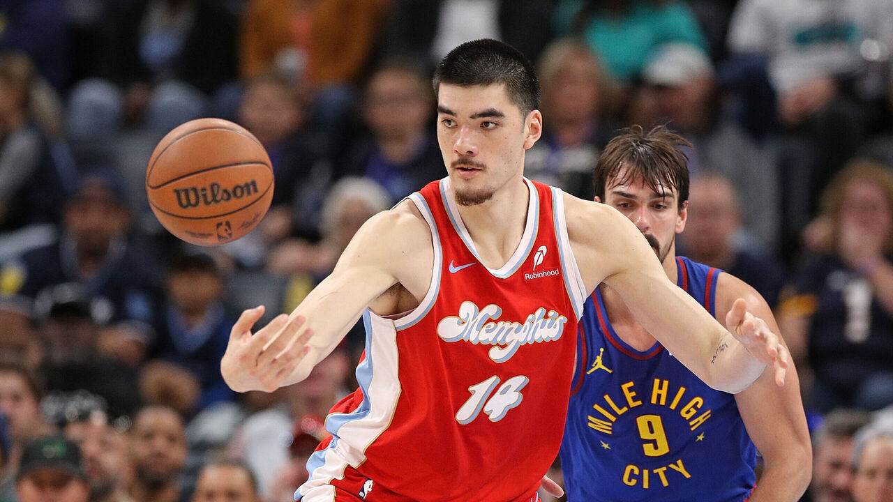 MEMPHIS, TENNESSEE - NOVEMBER 17: Zach Edey #14 of the Memphis Grizzlies handles the ball against Dario Saric #9 of the Denver Nuggets during the first half at FedExForum on November 17, 2024 in Memphis, Tennessee.