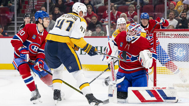 MONTREAL, CANADA- DECEMBER 5: Puck flies above the head of Sam Montembeault #35 of the Montreal Canadiens during the third period of the NHL regular season game between the Montreal Canadiens and the Nashville Predators at the Bell Centre on December 5, 2024 in Montreal, Quebec, Canada.