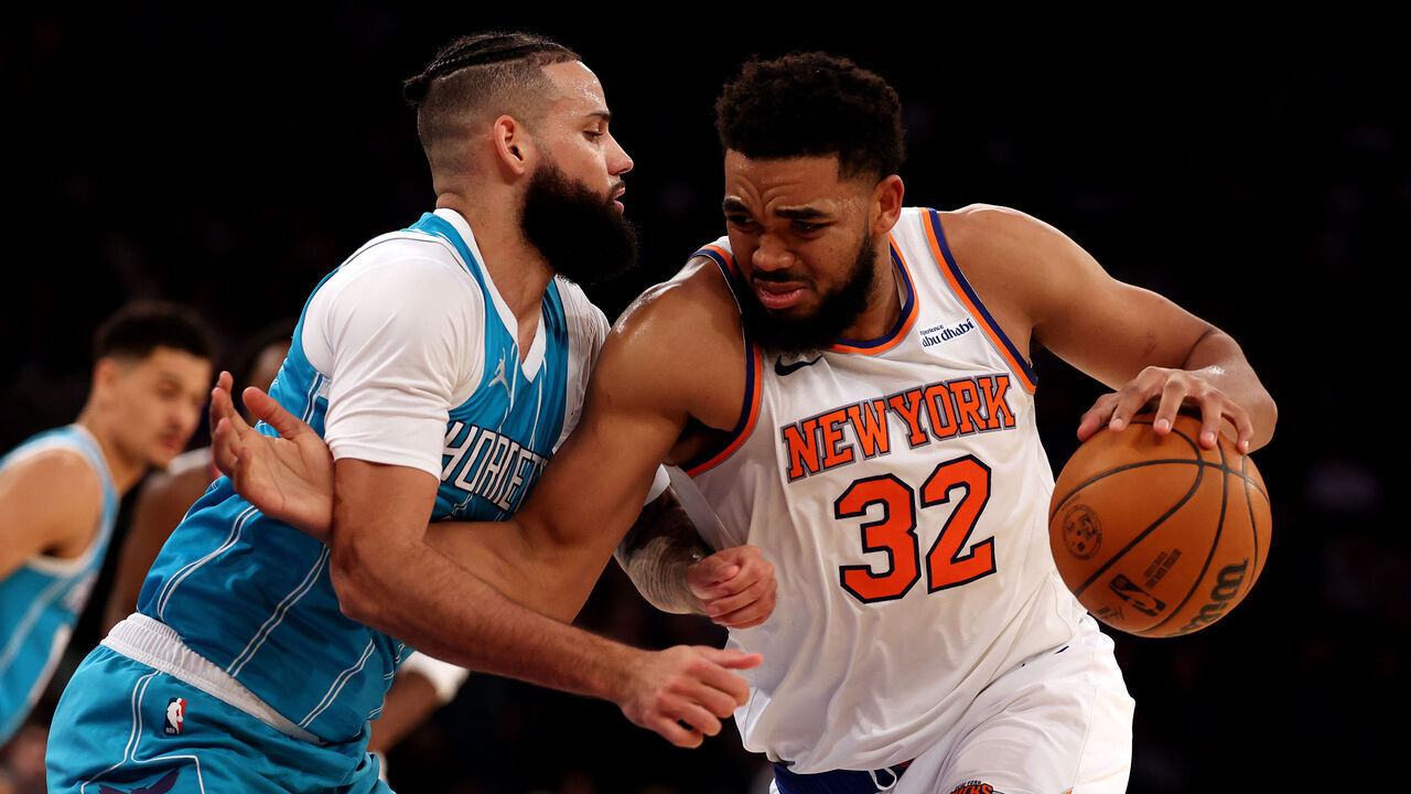 NEW YORK, NEW YORK - DECEMBER 05: Karl-Anthony Towns #32 of the New York Knicks drives against Cody Martin #11 of the Charlotte Hornets during their game at Madison Square Garden on December 05, 2024 in New York City. User expressly acknowledges and agrees that, by downloading and or using this photograph, User is consenting to the terms and conditions of the Getty Images License Agreement.