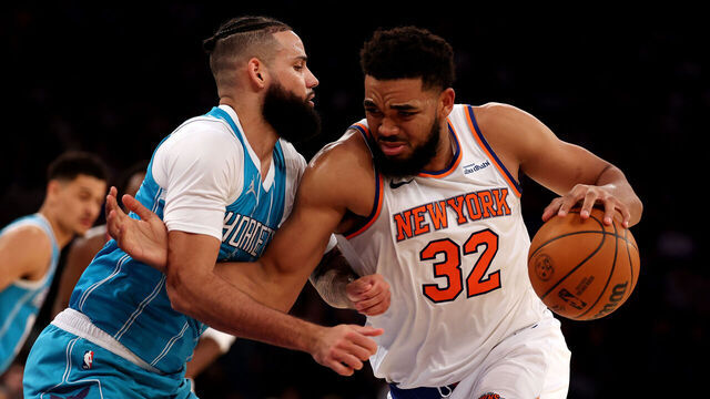 NEW YORK, NEW YORK - DECEMBER 05: Karl-Anthony Towns #32 of the New York Knicks drives against Cody Martin #11 of the Charlotte Hornets during their game at Madison Square Garden on December 05, 2024 in New York City. User expressly acknowledges and agrees that, by downloading and or using this photograph, User is consenting to the terms and conditions of the Getty Images License Agreement.
