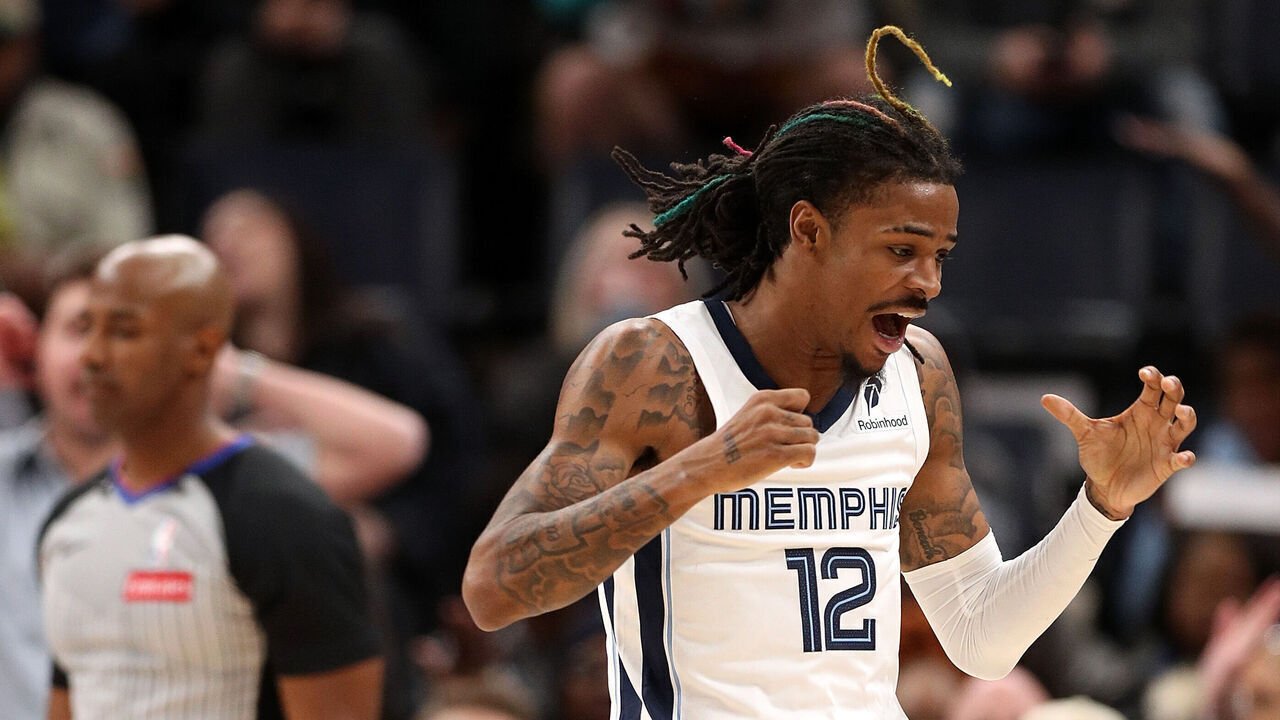 MEMPHIS, TENNESSEE - DECEMBER 05: Ja Morant #12 of the Memphis Grizzlies reacts during the second half after a foul is called against \S at FedExForum on December 05, 2024 in Memphis, Tennessee.