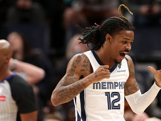 MEMPHIS, TENNESSEE - DECEMBER 05: Ja Morant #12 of the Memphis Grizzlies reacts during the second half after a foul is called against \S at FedExForum on December 05, 2024 in Memphis, Tennessee.