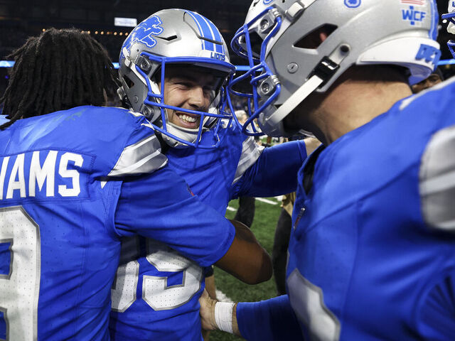 DETROIT, MICHIGAN - DECEMBER 05: Jake Bates #39 of the Detroit Lions celebrates with teammates after making a game-winning field goal in an NFL football game against the Green Bay Packers at Ford Field on December 5, 2024 in Detroit, Michigan.