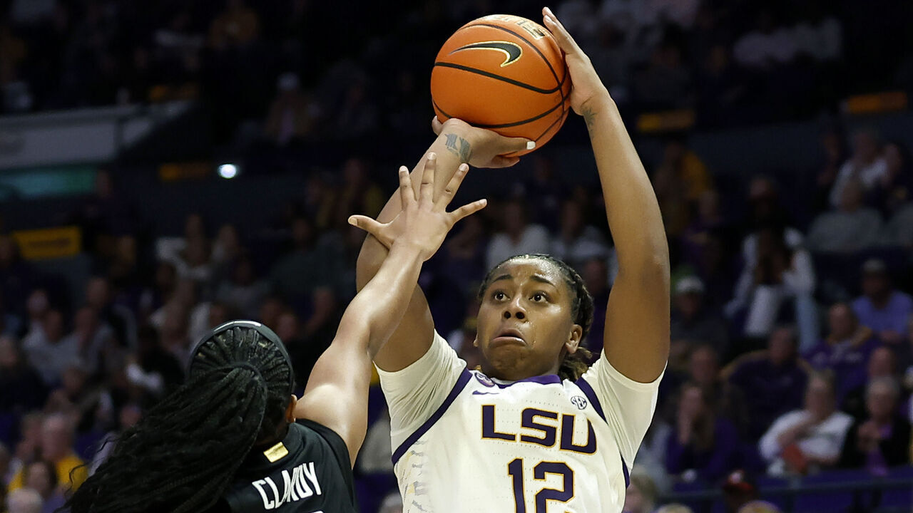BATON ROUGE, LOUISIANA - DECEMBER 05: Mikaylah Williams #12 of the LSU Lady Tigers takes a shot over Chloe Clardy #13 of the Stanford Cardinal during the second half of a game at Pete Maravich Assembly Center on December 05, 2024 in Baton Rouge, Louisiana.