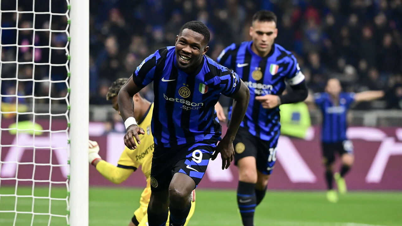TOPSHOT - Inter Milan's French forward #09 Marcus Thuram (C) reacts after scoring his team's third goal during the Italian Serie A football match between Inter Milan and Parma at the San Siro stadium in Milan, on December 6, 2024.