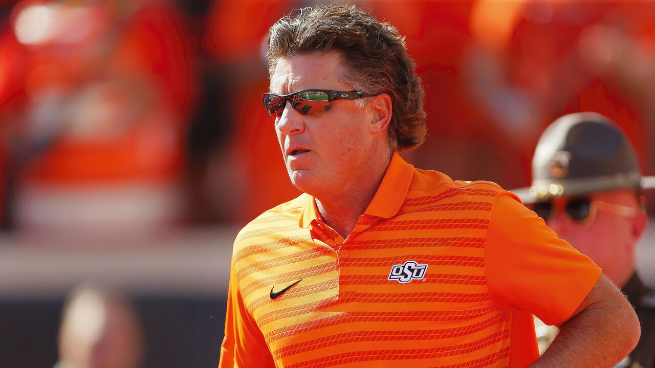 STILLWATER, OK - OCTOBER 5: Head coach Mike Gundy of the Oklahoma State Cowboys runs onto the field for a game against the West Virginia Mountaineers at Boone Pickens Stadium on October 5, 2024 in Stillwater, Oklahoma. West Virginia won 38-14.
