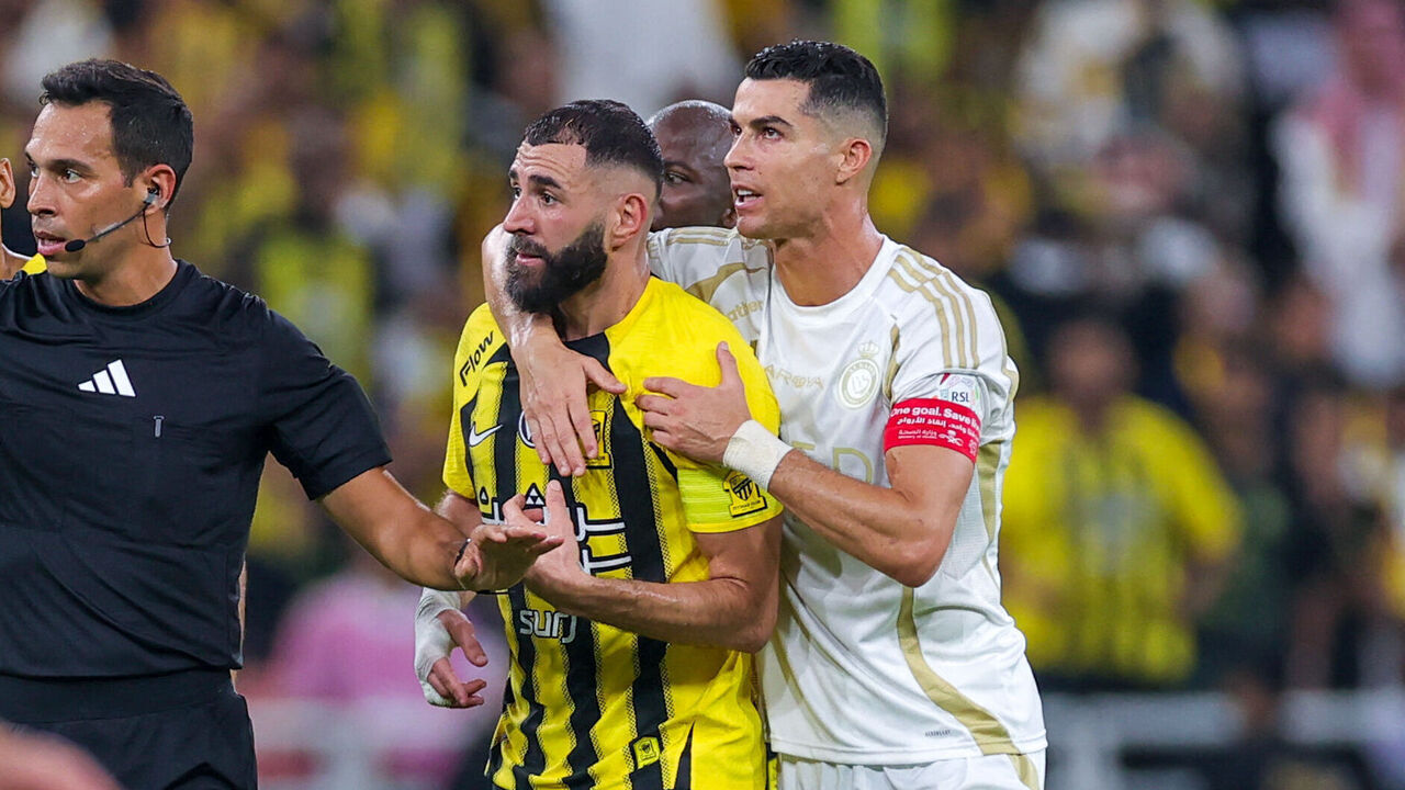 Nassr's Portuguese forward #7 Cristiano Ronaldo and Ittihad's French forward #09 Karim Benzema argue with the referee during the Saudi Pro League football match between Al-Ittihad and Al-Nassr at King Abdullah Sports City in Jeddah on December 6, 2024.
