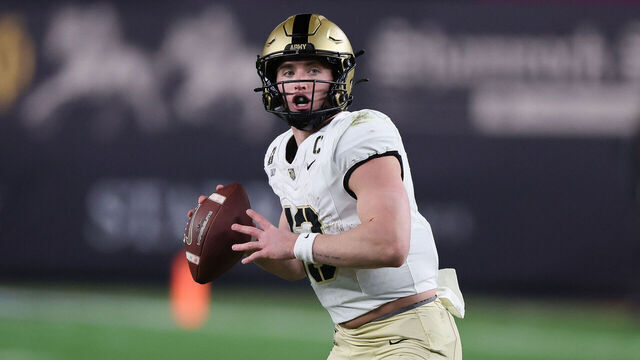 BRONX, NY - NOVEMBER 23: Army Black Knights quarterback Bryson Daily (13) drops back during a game between Army Black Knights and Notre Dame Fighting Irish on November 23, 2024 at Yankee Stadium in the Bronx, New York.