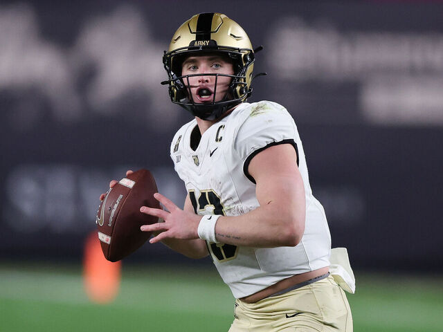 BRONX, NY - NOVEMBER 23: Army Black Knights quarterback Bryson Daily (13) drops back during a game between Army Black Knights and Notre Dame Fighting Irish on November 23, 2024 at Yankee Stadium in the Bronx, New York.