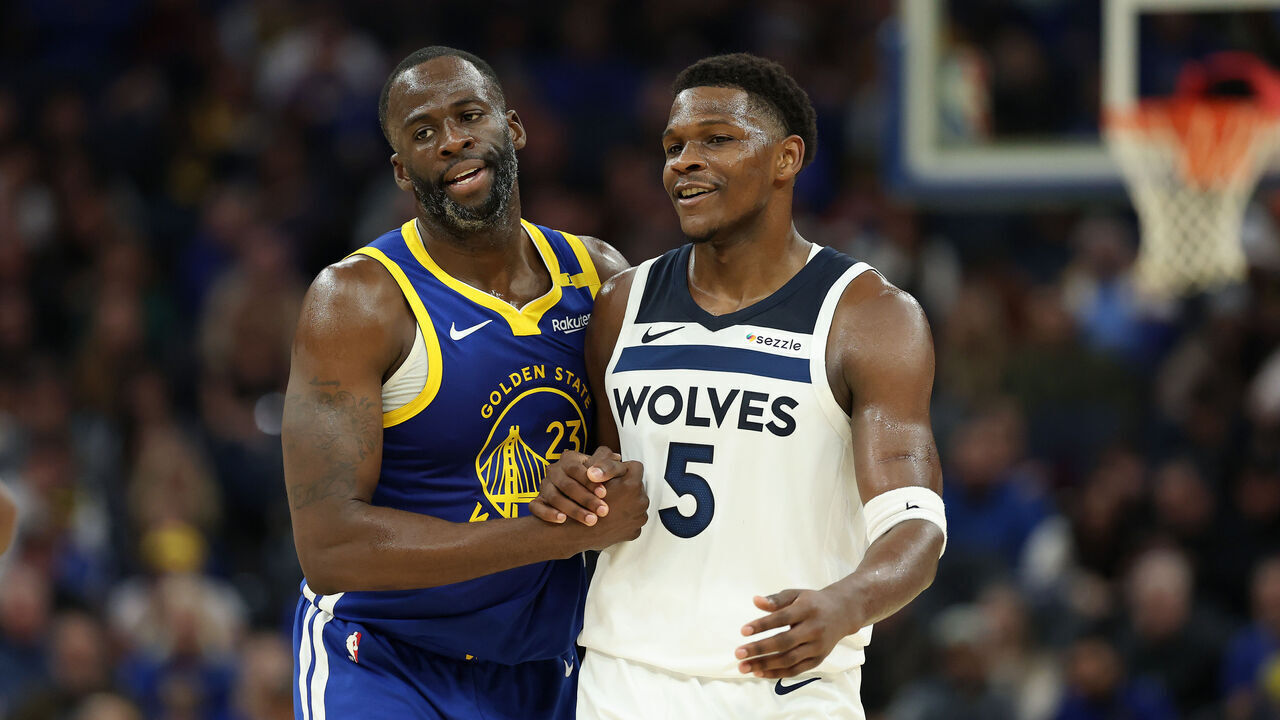 SAN FRANCISCO, CALIFORNIA - DECEMBER 06: Draymond Green #23 of the Golden State Warriors shakes hands with Anthony Edwards #5 of the Minnesota Timberwolves after Edwards ran into Green on a pick in the first half at Chase Center on December 06, 2024 in San Francisco, California. NOTE TO USER: User expressly acknowledges and agrees that, by downloading and/or using this photograph, user is consenting to the terms and conditions of the Getty Images License Agreement.