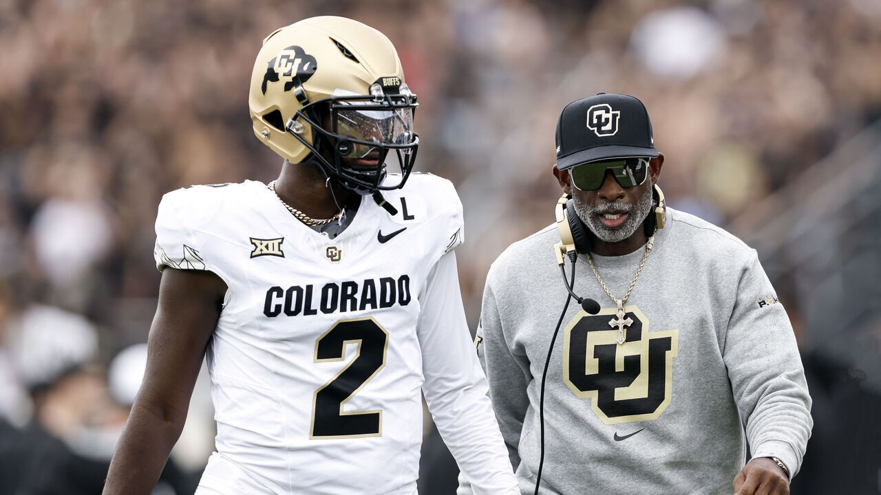 ORLANDO, FL - SEPTEMBER 28: Quarterback Shedeur Sanders #2 talk with Head Coach Deion Sanders of the Colorado Buffaloes prior to the game against the UCF Knights at FBC Mortgage Stadium on September 28, 2024 in Orlando, Florida. The Buffaloes defeated the Knights 48-21.