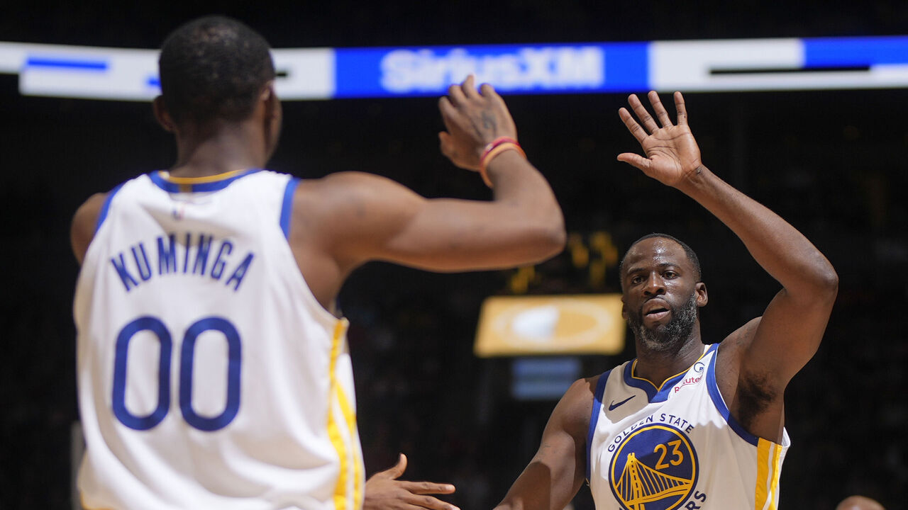 TORONTO, CANADA - MARCH 1: Draymond Green #23 of the Golden State Warriors & Jonathan Kuminga #00 of the Golden State Warriors high five during the game on March 1, 2024 at the Scotiabank Arena in Toronto, Ontario, Canada. Mandatory Copyright Notice: Copyright 2024 NBAE