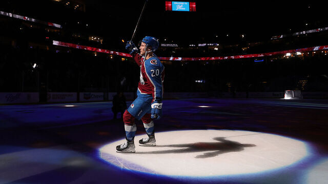 DENVER, COLORADO - OCTOBER 18: Ross Colton #20 of the Colorado Avalanche salutes the crowd after being named third star of the game against the Anaheim Ducks at Ball Arena on October 18, 2024 in Denver, Colorado. The Avalanche defeated the Ducks 4-3 in overtime.