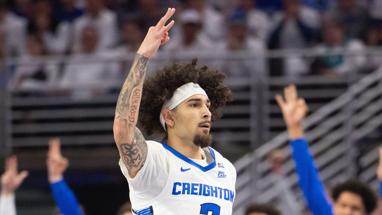 OMAHA, NE - DECEMBER 4: Creighton Bluejays guard Pop Isaacs (2) celebrates by holding up three fingers after making a three-pointer during the first half against the Kansas Jayhawks on December 04, 2024, at CHI Health Center Omaha in Omaha, NE.