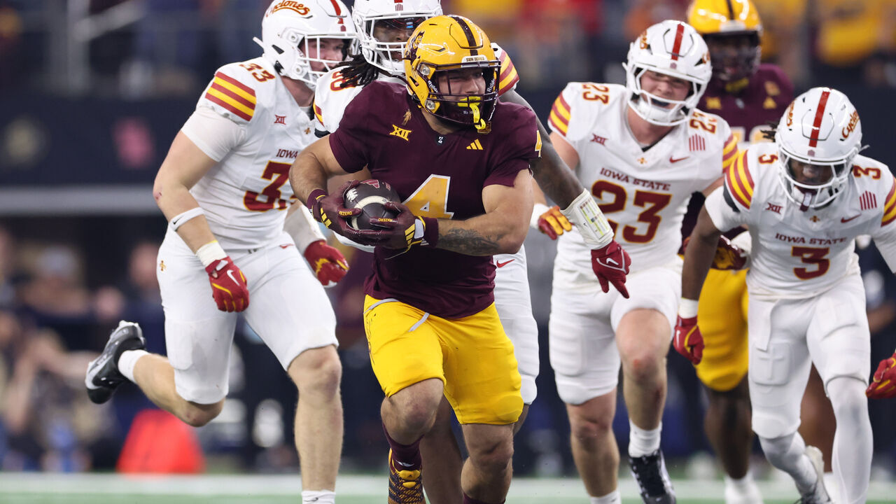 ARLINGTON, TEXAS - DECEMBER 07: Cam Skattebo #4 of the Arizona State Sun Devils carries the ball against the Iowa State Cyclones during the second quarter of the Big 12 Championship game at AT&T Stadium on December 07, 2024 in Arlington, Texas.