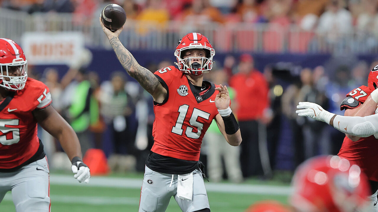 ATLANTA, GA - DECEMBER 07: Georgia Bulldogs quarterback Carson Beck (15) passes during the SEC championship football game between the Georgia Bulldogs and the Texas Longhorns on December 7, 2024 at the Mercedes-Benz Stadium in Atlanta, Georgia.