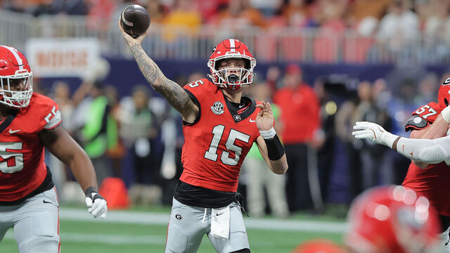 ATLANTA, GA - DECEMBER 07: Georgia Bulldogs quarterback Carson Beck (15) passes during the SEC championship football game between the Georgia Bulldogs and the Texas Longhorns on December 7, 2024 at the Mercedes-Benz Stadium in Atlanta, Georgia.