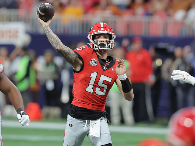 ATLANTA, GA - DECEMBER 07: Georgia Bulldogs quarterback Carson Beck (15) passes during the SEC championship football game between the Georgia Bulldogs and the Texas Longhorns on December 7, 2024 at the Mercedes-Benz Stadium in Atlanta, Georgia.