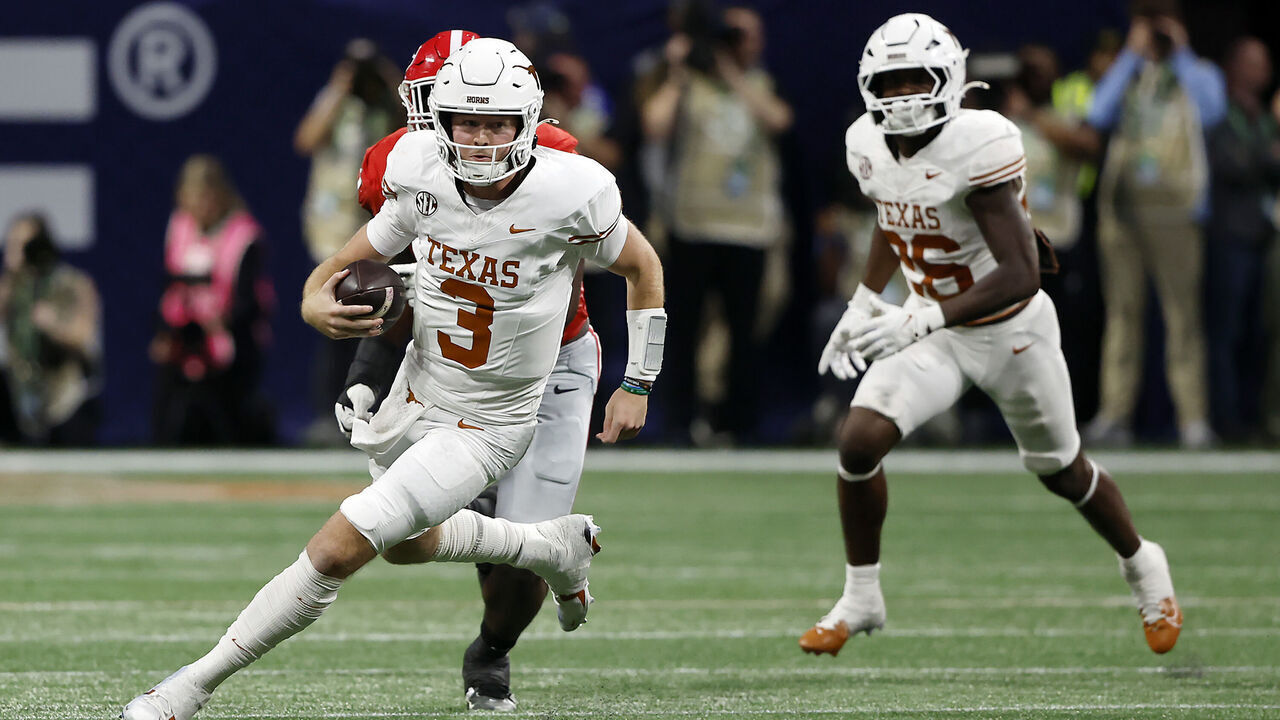 ATLANTA, GEORGIA - DECEMBER 07: Quinn Ewers #3 of the Texas Longhorns runs the ball against the Georgia Bulldogs during the second quarter of the 2024 SEC Championship at Mercedes-Benz Stadium on December 07, 2024 in Atlanta, Georgia.