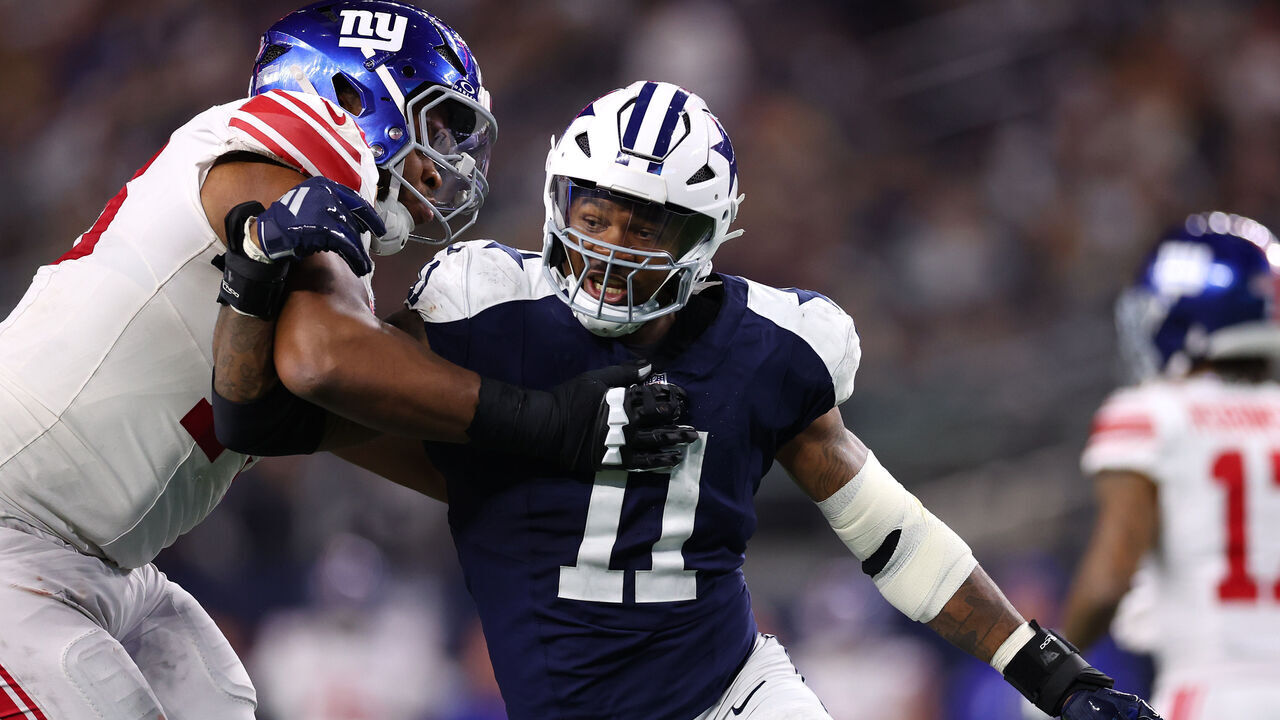 ARLINGTON, TEXAS - NOVEMBER 28: Micah Parsons #11 of the Dallas Cowboys defends during the second half against the New York Giants at AT&T Stadium on November 28, 2024 in Arlington, Texas.