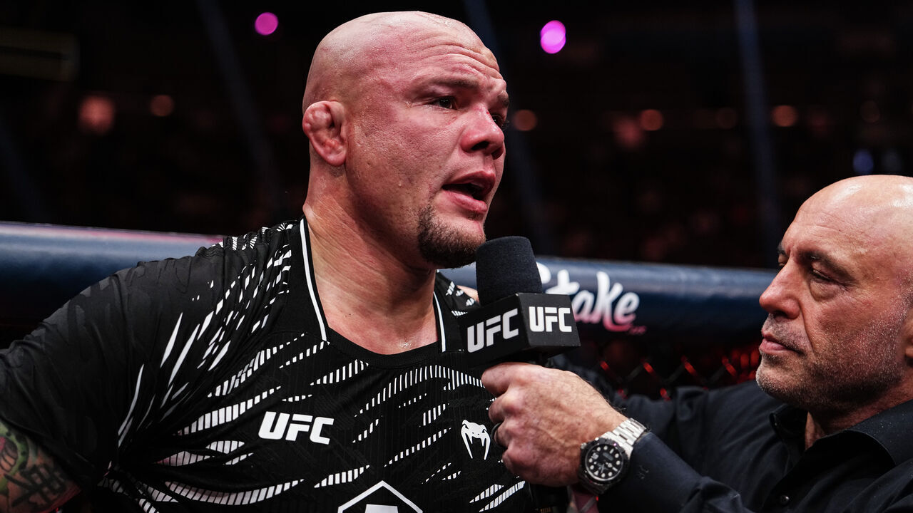 LAS VEGAS, NEVADA - DECEMBER 07: Anthony Smith is interviewed by Joe Rogan after a light heavyweight bout against Dominick Reyes during the UFC 310 event at T-Mobile Arena on December 07, 2024 in Las Vegas, Nevada.