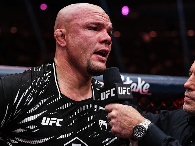 LAS VEGAS, NEVADA - DECEMBER 07: Anthony Smith is interviewed by Joe Rogan after a light heavyweight bout against Dominick Reyes during the UFC 310 event at T-Mobile Arena on December 07, 2024 in Las Vegas, Nevada.