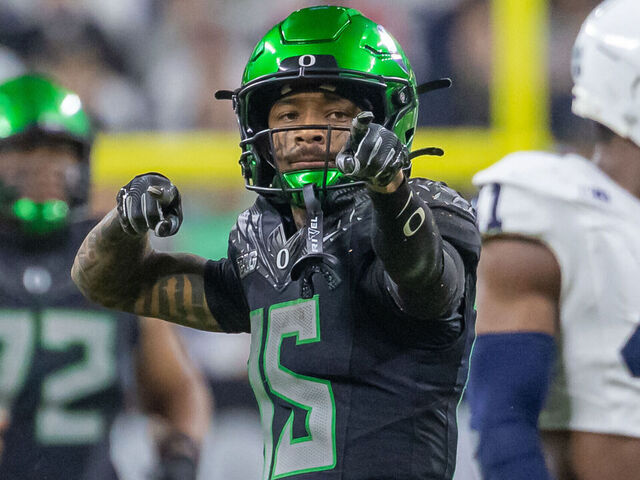 INDIANAPOLIS, INDIANA - DECEMBER 7: Tez Johnson #15 of the Oregon Ducks reacts after a first down during the first half of the 2024 Big Ten Football Championship game against the Penn State Nittany Lions at Lucas Oil Stadium on December 7, 2024 in Indianapolis, Indiana.