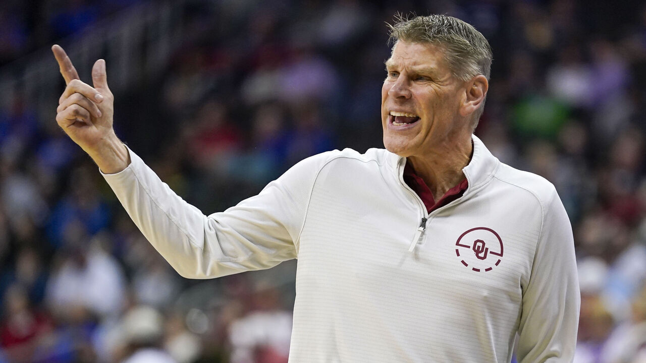 KANSAS CITY, MISSOURI - MARCH 13: Head coach Porter Moser of the Oklahoma Sooners reacts during the first half of the game against the TCU Horned Frogs in the second round of the Big 12 Men's Basketball Tournament at T-Mobile Center on March 13, 2024 in Kansas City, Missouri.
