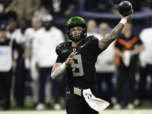 INDIANAPOLIS, IN - DECEMBER 07: Oregon Ducks QB Dillon Gabriel (8) throws a pass during a college football game between the Penn State Nittany Lions and Oregon Ducks on December 7, 2024 at Lucas Oil Stadium in Indianapolis, IN