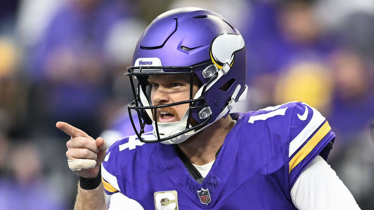MINNEAPOLIS, MINNESOTA - DECEMBER 1: Quarterback Sam Darnold #14 of the Minnesota Vikings reacts after throwing a touchdown pass in the third quarter of the game against the Arizona Cardinals at U.S. Bank Stadium on December 1, 2024 in Minneapolis, Minnesota.