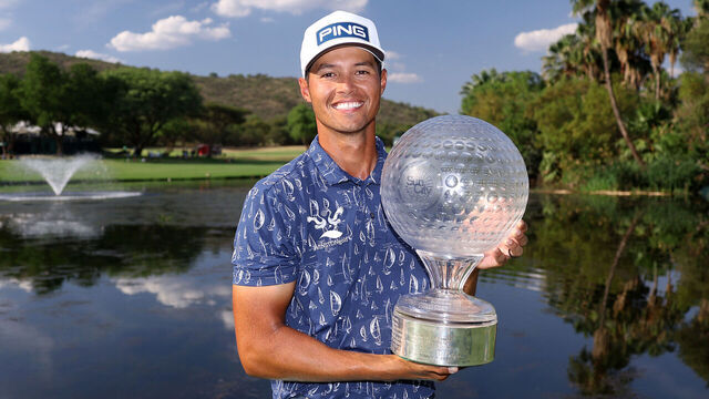 SUN CITY, SOUTH AFRICA - DECEMBER 08: Johannes Veerman of the United States poses with the trophy on the 18th green following victory on day four of the Nedbank Golf Challenge 2025 at Gary Player CC on December 08, 2024 in Sun City, South Africa.