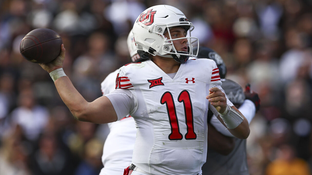 BOULDER, COLORADO - NOVEMBER 16: Isaac Wilson #11 of the Utah Utes throws a pass during the second half against the Colorado Buffaloes at Folsom Field on November 16, 2024 in Boulder, Colorado.