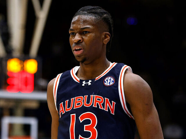 DURHAM, NORTH CAROLINA - DECEMBER 4: Miles Kelly #13 of the Auburn Tigers reacts following a three-point basket against the Duke Blue Devils at Cameron Indoor Stadium on December 4, 2024 in Durham, North Carolina.