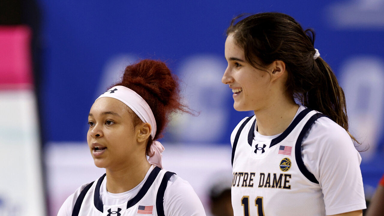 GREENSBORO, NORTH CAROLINA - MARCH 8: KK Bransford #14, Hannah Hidalgo #3 and Sonia Citron #11 of the Notre Dame Fighting Irish celebrate following their victory against the Louisville Cardinals in the Quarterfinals of the ACC Women's Basketball Tournament at Greensboro Coliseum on March 8, 2024 in Greensboro, North Carolina.