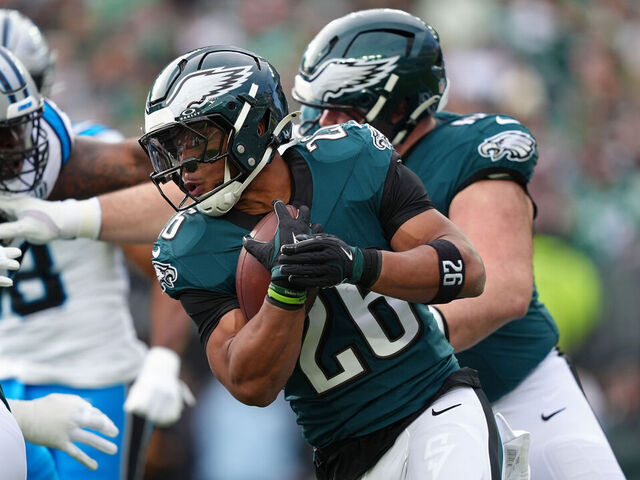 PHILADELPHIA, PA - DECEMBER 08: Philadelphia Eagles running back Saquon Barkley (26) carries the ball in the first half during the game between the Carolina Panthers and Philadelphia Eagles on December 08, 2024 at Lincoln Financial Field in Philadelphia, PA.